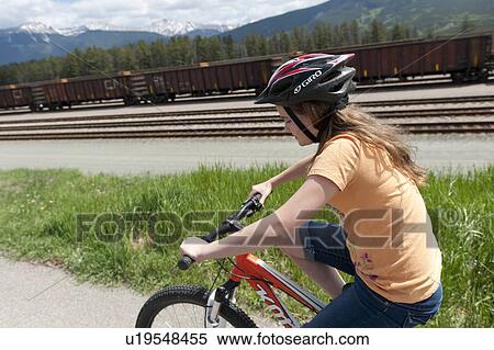 Girl cycling along railroad tracks, Jasper Heritage Railway Station, Jasper National Park, Alberta, Canada View Large Photo Image Stock Photography - Girl cycling along railroad tracks, Jasper Heritage Railway Station, Jasper National Park, Alberta, Canada. Fotosearch