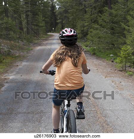 Girl riding a bicycle, Jasper National Park, Alberta, Canada View Large Photo Image Stock Image - Girl riding a bicycle, Jasper National Park, Alberta, Canada. Fotosearch