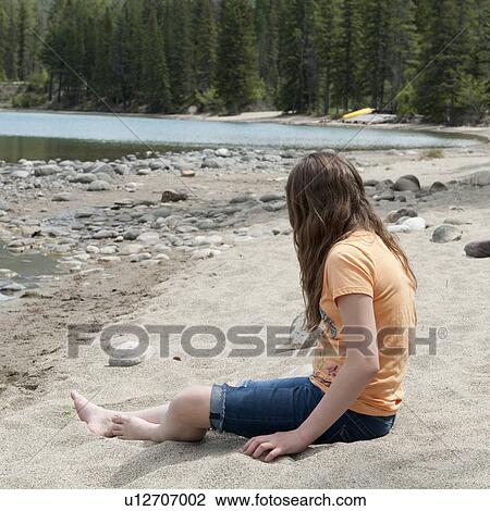 Girl sitting on sand at the lakeside, Edith Lake, Jasper National Park, Alberta, Canada View Large Photo Image Stock Image - Girl sitting on sand at the lakeside, Edith Lake, Jasper National Park, Alberta, Canada. Fotosearch