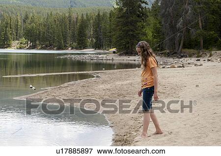 Girl standing at the lakeside, Edith Lake, Jasper National Park, Alberta, Canada View Large Photo Image Stock Photo - Girl standing at the lakeside, Edith Lake, Jasper National Park, Alberta, Canada. Fotosearch