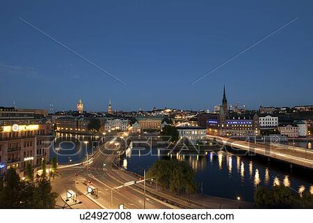 Stock Photo - High angle view of a city at dusk, Stockholm, Sweden. Fotosearch