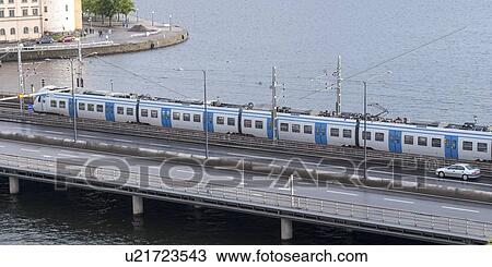 Stock Image - High angle view of a train moving on the bridge, Stockholm, Sweden. Fotosearch