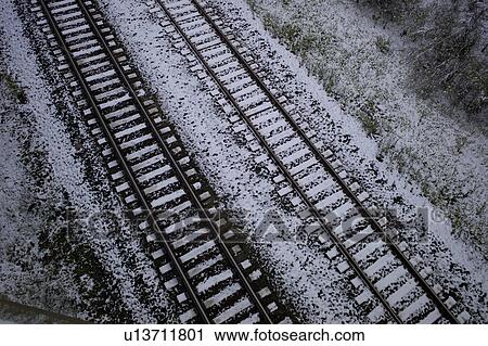 High angle view of snow covered railroad tracks, Northern Alberta, Alberta, Canada View Large Photo Image Stock Image - High angle view of snow covered railroad tracks, Northern Alberta, Alberta, Canada. Fotosearch