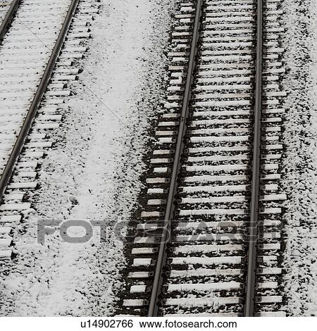 Stock Photograph - High angle view of snow covered railroad tracks, Northern Alberta, Alberta, Canada. Fotosearch