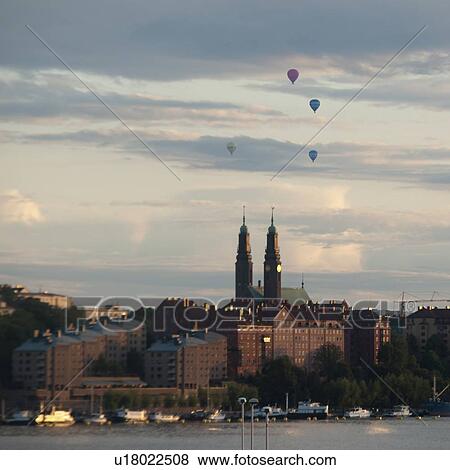 Hot air balloons over a city, Stockholm, Sweden View Large Photo Image Stock Photo - Hot air balloons over a city, Stockholm, Sweden. Fotosearch