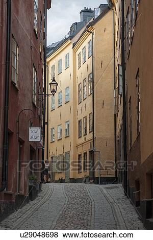 Stock Photo - Houses both sides of a street, Gamla Stan, Stockholm, Sweden. Fotosearch