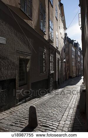 Stock Photography - Houses both sides of a street, Gamla Stan, Stockholm, Sweden. Fotosearch