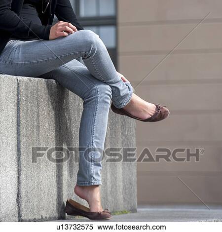 Stock Photography - Legs of a woman sitting in a palace, Stockholm Palace, Gamla Stan, Stockholm, Sweden. Fotosearch