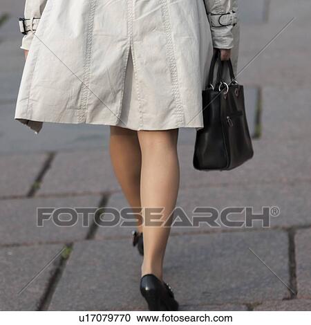 Stock Image - Legs of a woman walking, St. Petersburg, Russia. Fotosearch