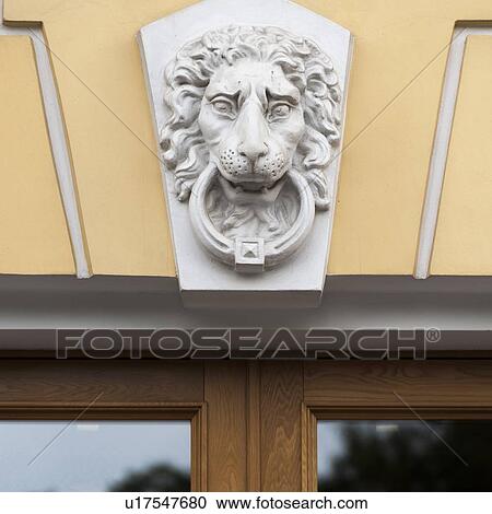 Lion's face statue carved on the wall of a building, St. Petersburg, Russia View Large Photo Image Stock Image - Lion's face statue carved on the wall of a building, St. Petersburg, Russia. Fotosearch