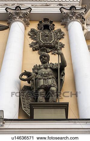 Stock Image - Low angle view of a soldier statue on Triumphal Arch of General Staff Building, State Hermitage Museum, Palace Square, St. Petersburg, Russia. Fotosearch