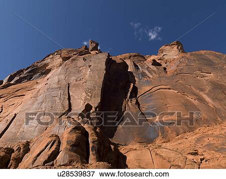 Stock Photo - Low angle view of sandstone cliff, Glen Canyon National Recreation Area, Colorado River Float Trip, Colorado River, Arizona-Utah, USA. Fotosearch