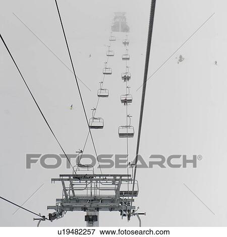 Low angle view of skiers on ski lifts, Symphony Amphitheatre, Whistler, British Columbia, Canada View Large Photo Image Stock Photo - Low angle view of skiers on ski lifts, Symphony Amphitheatre, Whistler, British Columbia, Canada. Fotosearch