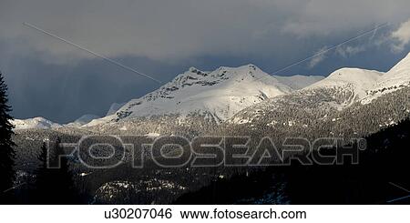 Low angle view of snow covered mountains in winter, Whistler, British Columbia, Canada View Large Photo Image Stock Photograph - Low angle view of snow covered mountains in winter, Whistler, British Columbia, Canada. Fotosearch