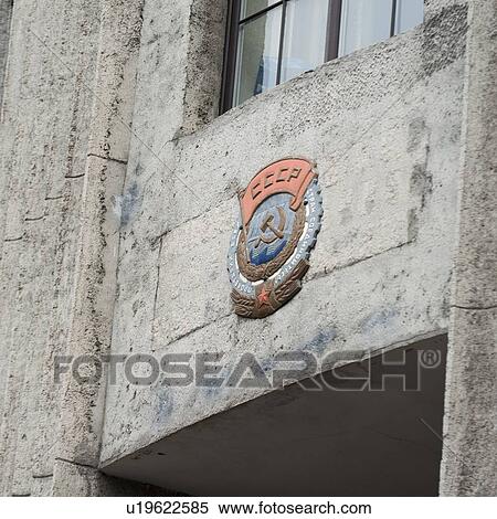 Stock Photography - Low angle view of the Emblem of Union of Soviet Socialist Republic on the wall of a building, St. Petersburg, Russia. Fotosearch