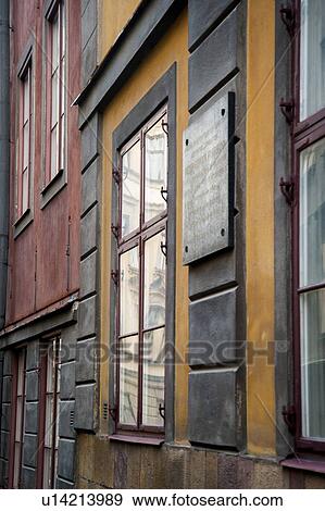 Stock Photo - Low angle view of windows of houses at Svartmangatan, Gamla Stan, Stockholm, Sweden. Fotosearch