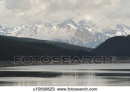 Stock Image - Maligne Lake with mountains in the background, Jasper National Park, Alberta, Canada. Fotosearch
