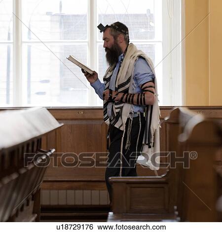 Man reading the Bible in the Grand Choral Synagogue, St. Petersburg, Russia View Large Photo Image Stock Photograph - Man reading the Bible in the Grand Choral Synagogue, St. Petersburg, Russia. Fotosearch