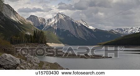 Stock Image - Medicine Lake with mountain in background, Jasper National Park, Alberta, Canada. Fotosearch