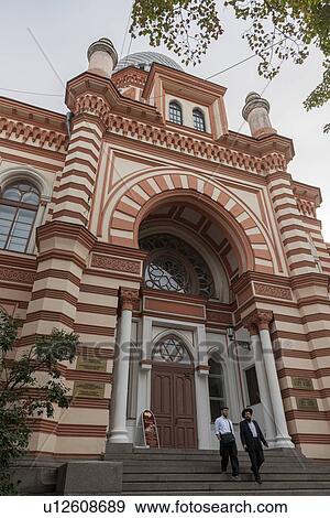 Stock Photo - Men moving down steps of the Grand Choral Synagogue, St. Petersburg, Russia. Fotosearch