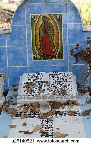 Stock Image - Painting of Our Lady of Guadalupe in a shrine, Sayulita, Nayarit, Mexico. Fotosearch