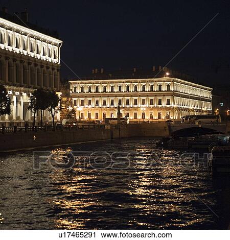 Stock Image - Palace lit up at night, Mariinsky Palace, Moyka River, St. Petersburg, Russia. Fotosearch