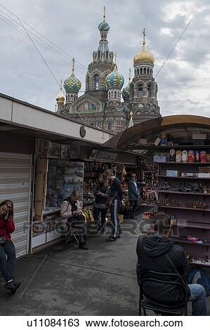 People in a market with the Church of the Saviour on Spilled Blood in the background, St. Petersburg, Russia View Large Photo Image Stock Image - People in a market with the Church of the Saviour on Spilled Blood in the background, St. Petersburg, Russia. Fotosearch