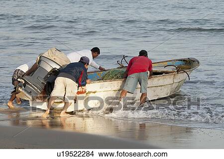 People pushing a boat into the sea, Sayulita, Nayarit, Mexico View Large Photo Image Picture - People pushing a boat into the sea, Sayulita, Nayarit, Mexico. Fotosearch
