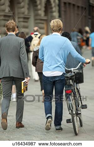 Stock Photo - People walking on a street, Gamla Stan, Stockholm, Sweden. Fotosearch