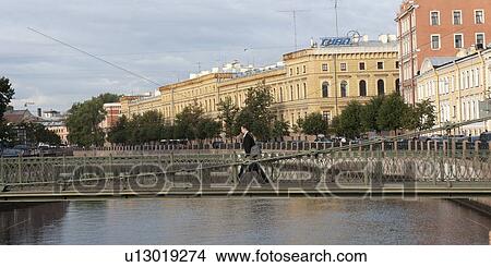 Person crossing a bridge, Pochtamtsky Bridge, Moyka River, St. Petersburg, Russia View Large Photo Image Picture - Person crossing a bridge, Pochtamtsky Bridge, Moyka River, St. Petersburg, Russia. Fotosearch
