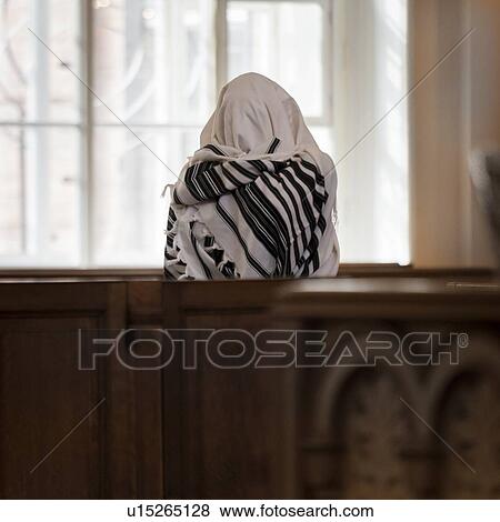 Stock Photo - Person praying in the Grand Choral Synagogue, St. Petersburg, Russia. Fotosearch
