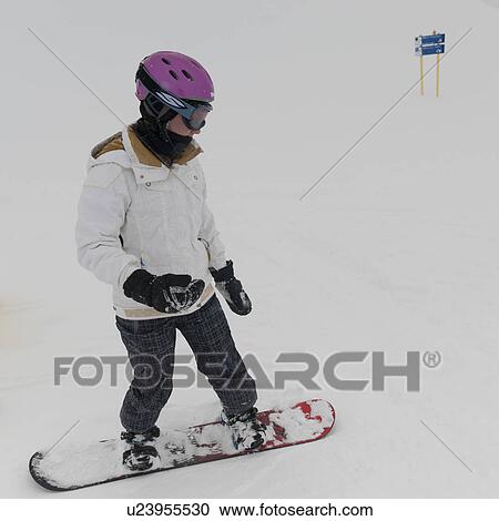 Stock Image - Person snowboarding, Whistler, British Columbia, Canada. Fotosearch