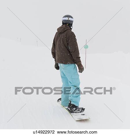 Stock Image - Person snowboarding, Whistler Mountain, Whistler, British Columbia, Canada. Fotosearch