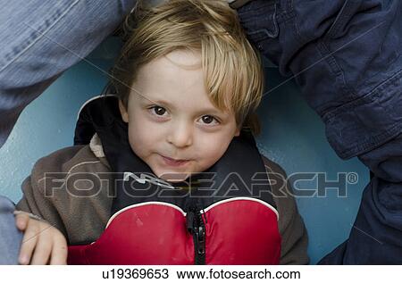 Portrait of a boy wearing a life jacket, Glen Canyon National Recreation Area, Arizona-Utah, USA View Large Photo Image Stock Image - Portrait of a boy wearing a life jacket, Glen Canyon National Recreation Area, Arizona-Utah, USA. Fotosearch