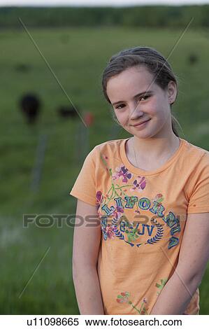 Stock Photography - Portrait of a girl smiling, Northern Alberta, Alberta, Canada. Fotosearch