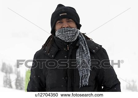 Stock Image - Portrait of a man in warm clothing, Whistler, British Columbia, Canada. Fotosearch