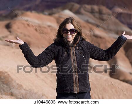 Stock Image - Portrait of a woman posing, Paria Canyon, Paria, Kane County, Utah, USA. Fotosearch