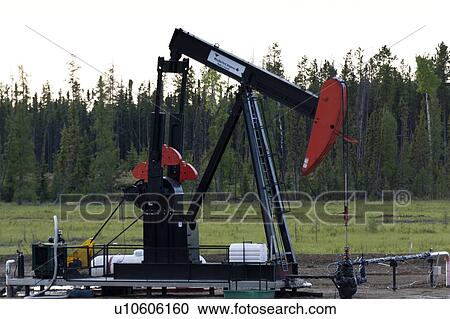 Stock Image - Pump jack at an oil rig, Northern Alberta, Alberta, Canada. Fotosearch