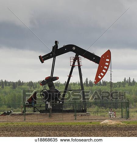 Pump jack at an oil rig, Northern Alberta, Alberta, Canada View Large Photo Image Stock Photography - Pump jack at an oil rig, Northern Alberta, Alberta, Canada. Fotosearch