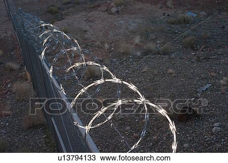 Razor wire on a fence on the coast, Lake Powell, Arizona-Utah, USA View Large Photo Image Stock Image - Razor wire on a fence on the coast, Lake Powell, Arizona-Utah, USA. Fotosearch