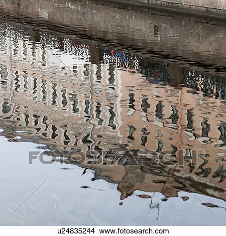 Picture - Reflection of a building on water, Griboyedov Canal, St. Petersburg, Russia. Fotosearch