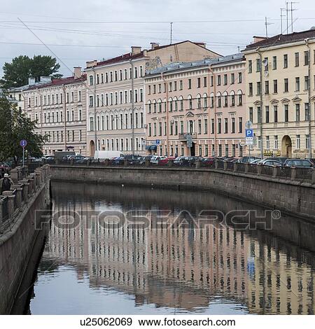 Stock Photo - Reflection of a building on water, Griboyedov Canal, St. Petersburg, Russia. Fotosearch