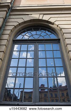 Reflection of clouds on the window of a building, Gamla Stan, Stockholm, Sweden View Large Photo Image Stock Image - Reflection of clouds on the window of a building, Gamla Stan, Stockholm, Sweden. Fotosearch