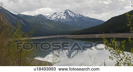 Reflection of mountain in Medicine Lake, Jasper National Park, Alberta, Canada View Large Photo Image Stock Image - Reflection of mountain in Medicine Lake, Jasper National Park, Alberta, Canada. Fotosearch