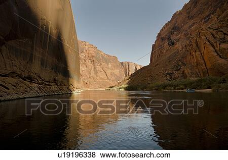 Stock Photo - Reflection of rocks in a river, Colorado River, Glen Canyon National Recreation Area, Arizona-Utah, USA. Fotosearch