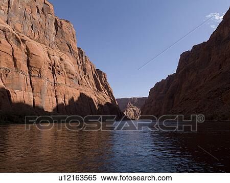 Stock Photography - Reflection of rocks in water, Glen Canyon National Recreation Area, Colorado River Float Trip, Colorado River, Arizona-Utah, USA. Fotosearch