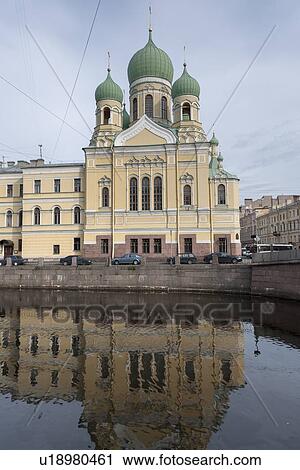 Stock Image - Reflection of the Church of Ss. Isidor and Nicholas in Griboyedov Canal, St. Petersburg, Russia. Fotosearch