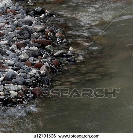 Stock Photograph - River flowing through rocks, Whistler, British Columbia, Canada. Fotosearch