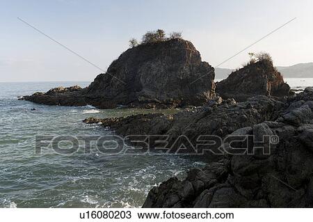 Stock Image - Rock formation at the coast, Sayulita, Nayarit, Mexico. Fotosearch