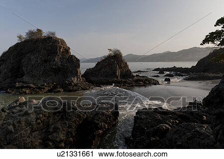 Stock Image - Rock formation at the coast, Sayulita, Nayarit, Mexico. Fotosearch
